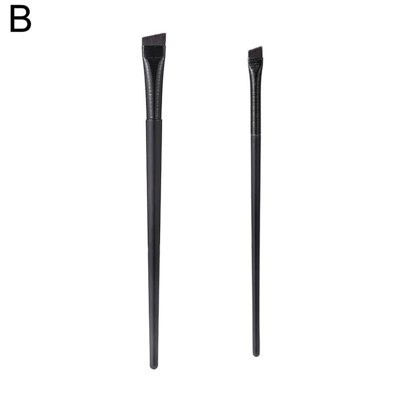Angled blade eyeliner brush, sickle-shaped flat eyeliner brush, extending from the lower eyelid to the under-eye area, detailing eye makeup tools.
